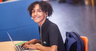 Empower Generations learner at laptop