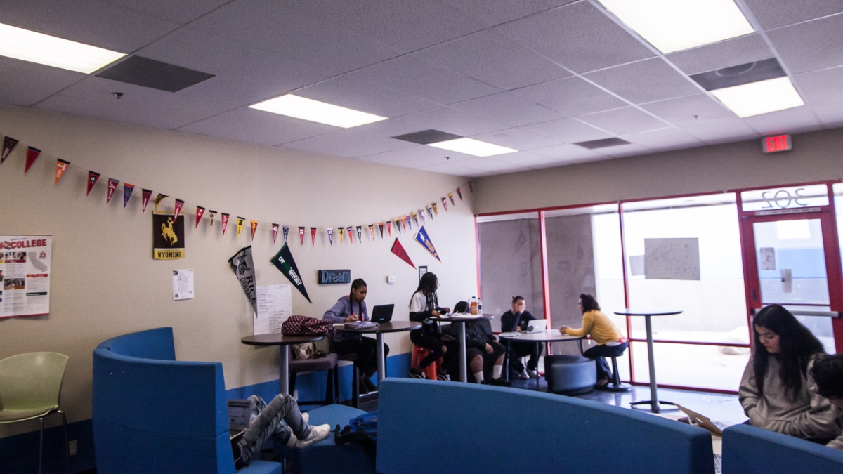 Empower Generations learners in common area on campus