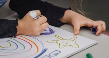 child drawing with marker
