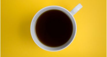 coffee cup on yellow background