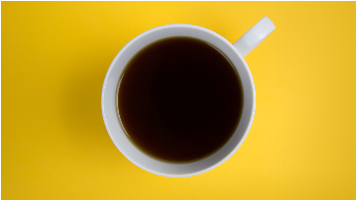 coffee cup on yellow background