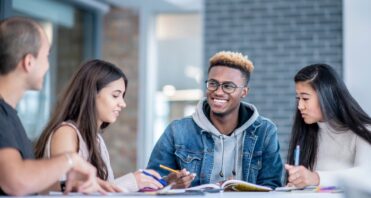 Teens sitting together learning